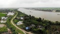 River and village road dike on a summer day Royalty Free Stock Photo