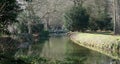 River walk at Lode Cambridgeshire with Bridge, stream and trees.