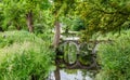 Small old arched bridge in Morden Hall Park Park