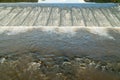 River water flows freely over the top of the weir
