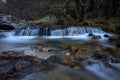 River water flows among the rocks and forms small waterfalls, RascafrÃÂ­a, Madrid, Spain Royalty Free Stock Photo