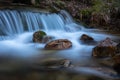 River water flows among the rocks and forms small waterfalls, RascafrÃÂ­a, Madrid, Spain Royalty Free Stock Photo