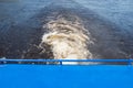River water perspective surface. Motor boat travel background. Cruise ship trail. Top view of boiling lake water. Foamy trail of a Royalty Free Stock Photo