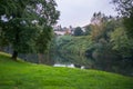 River water reflection green grass meadow tree village town Royalty Free Stock Photo