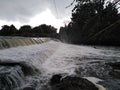 River water tumbling over the wier of the low-level bridge