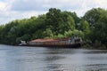 River watrer, lonely rusty cargo ship dire straits Royalty Free Stock Photo