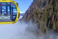 A river of white fog in the mountains and a ski lift in the foreground. Selective focus in the background.Alpine Alps mountain Royalty Free Stock Photo