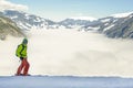 A river of white fog in the mountains and skier in front are preparing for the descent.Alpine Alps mountain landscape at Tirol, Royalty Free Stock Photo