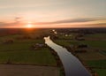 River Winding Through The Fields