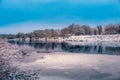 River in winter on the banks of the snow