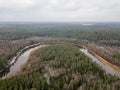 River in winter forest with green trees from above. Aerial drone image of river Gauja in Latvia Royalty Free Stock Photo