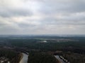 River in winter forest with green trees from above. Aerial drone image of river Gauja in Latvia Royalty Free Stock Photo