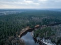 River in winter forest with green trees from above. Aerial drone image of river Gauja in Latvia Royalty Free Stock Photo