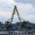 River at work cranes in winter