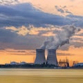 Riverbank with nuclear power plant Doel during a sunset with dramatic clouds, Port of Antwerp