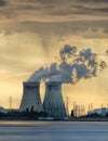 Riverbank with nuclear power plant Doel during a sunset with dramatic cluds, Port of Antwerp Royalty Free Stock Photo