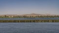 In the riverbed there is an islet overgrown with green grass. Royalty Free Stock Photo