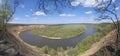 Riverbend in deep spring forestm with green trees on the bank of the river and sands under blue sky Royalty Free Stock Photo