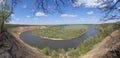 Riverbend in deep spring forestm with green trees on the bank of the river and sands under blue sky Royalty Free Stock Photo