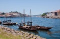 Riverboats with wooden barrels with port wine, old boats from some wineries on river Douro Royalty Free Stock Photo