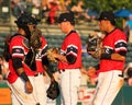 RiverDogs meet at the mound.