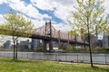 Queensbridge Park along the East River with the Queensboro Bridge and Green Trees during Spring in Long Island City Queens New Yor Royalty Free Stock Photo