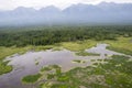 The rivers and lakes of Eastern Siberia from the altitude. A view from the cockpit of the helicopter to the lakes and the river in