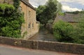 Rivers - River Windrush flowing under a bridge