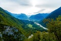 Rivers in the valley and hills in the background. Soca River in Slovenia. Royalty Free Stock Photo