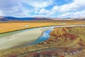 River on yellow grassland in autumn Royalty Free Stock Photo