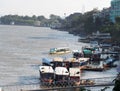 Riverscape tourist boats and business scene over MEKONG river, at GOLDEN TRIANGLE