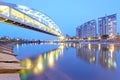 Riverside buildings and the famous HuanDong Rainbow Bridge over Keelung River at dusk in Taipei Taiwan, Asia