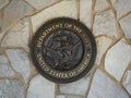 Riverside, California USA - June 16, 2021: U.S. Navy seal, crest or plaque on flagstone background