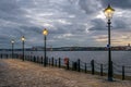 Riverside Cobbled Footpath at Sunset Royalty Free Stock Photo