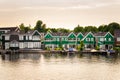 Riverside Colourful Wooden Houses at Sunset Royalty Free Stock Photo