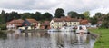 Riverside at Coltishall, Norfolk Broads, UK with boats and local inn