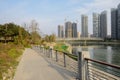 Riverside concrete path in modern city of sunny winter afternoon