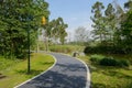 Riverside curving path in sunny spring morning