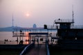 Riverside Docked Barge and Observation Tower at Sunset for Urban Backgrounds Royalty Free Stock Photo