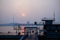 Riverside Docked Barge and Observation Tower at Sunset for Urban Backgrounds Royalty Free Stock Photo