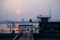 Riverside Docked Barge and Observation Tower at Sunset for Urban Backgrounds Royalty Free Stock Photo