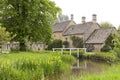 Riverside English village homes in summer picturesque setting Royalty Free Stock Photo