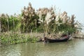 The riverside landscape of rural West Bengal with fishing boat.