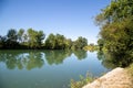 Riverside landscape under a blue sky