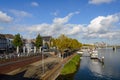 Riverside of Meuse river from Sint Servaasbrug, historical footbridge, and background of cityscape and Wilhelminabrug bridge.