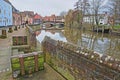The riverside river Wensum with colorful houses and the Fye Bridge in the background