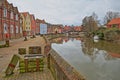 The riverside river Wensum with colorful houses and the Fye Bridge in the background