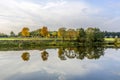 Riverside scene with trees that are reflected in the river Tauber Royalty Free Stock Photo