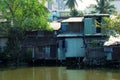 Riverside slum, houses near polluted river