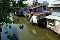 Riverside slum, houses near polluted river